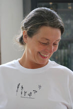 Load image into Gallery viewer, Dancing wildflower embroidered slogan organic t-shirt.
