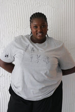 Load image into Gallery viewer, Large wildflower with doodle bee sleeve t-shirt