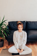 Load image into Gallery viewer, Festive lots of dinos embroidered sweater