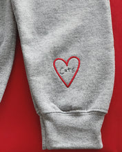 Load image into Gallery viewer, Cat doodle embroidered sweater with heart cat sleeve detail