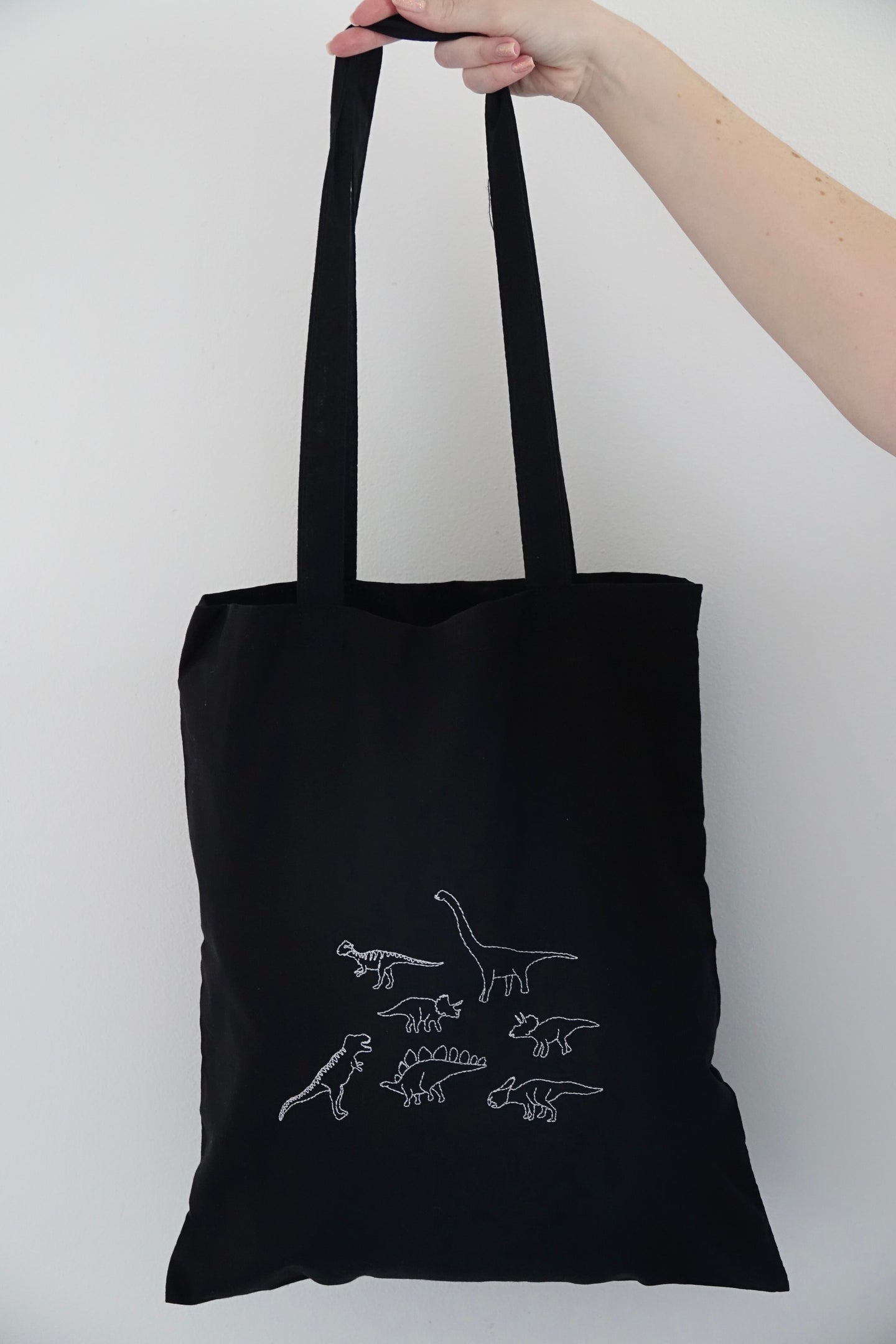Lots of dinosaurs embroidered tote bag