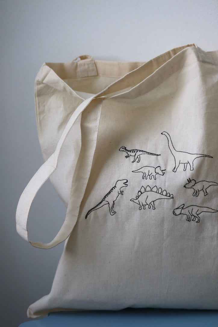 Lots of dinosaurs embroidered tote bag