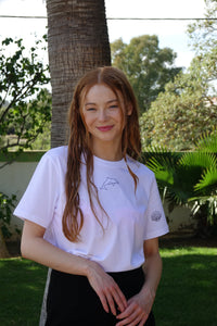 Dolphin with shell sleeve embroidered organic t-shirt.