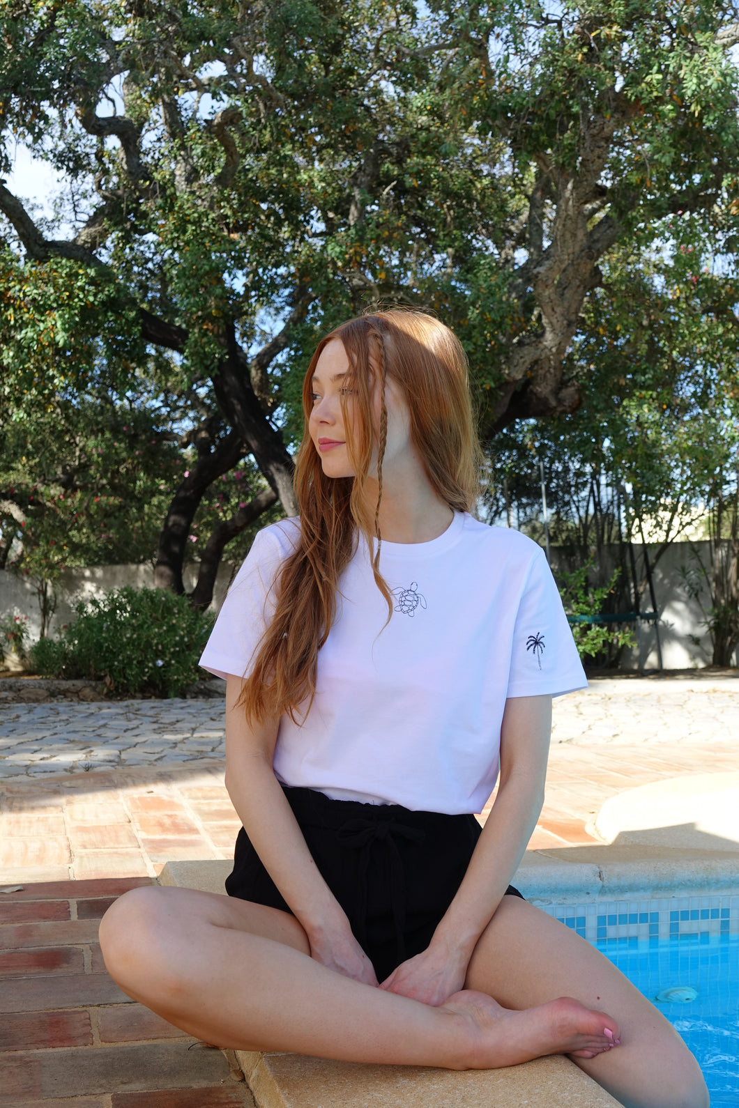Turtle with palm tree sleeve embroidered organic t-shirt.