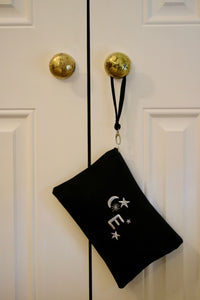 Canvas clutch bag in black with metallic star moon initial embroidery