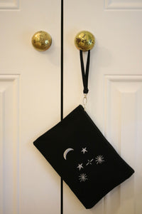 Canvas clutch bag in black with metallic constellation embroidery