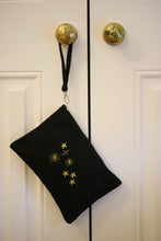 Load image into Gallery viewer, Canvas clutch bag in black with metallic constellation embroidery
