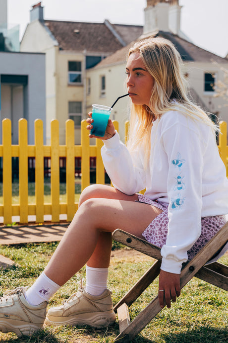 Embroidered bee sleeve sweater