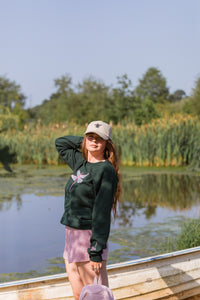 The fancy Holographic dragonfly embroidered on the front sweater