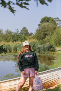 The fancy Holographic dragonfly embroidered on the front sweater