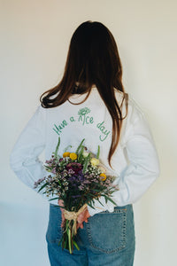 Have a nice day and daisy embroidered slogan sweater