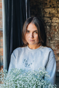 Dancing in the wildflower embroidered slogan sweater
