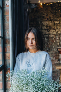 Dancing in the wildflower embroidered slogan sweater