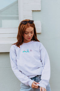 Embroidered trio of colourful moths sweater