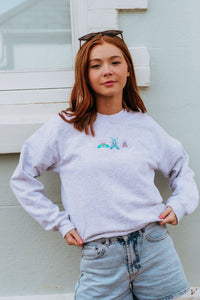 Embroidered trio of colourful moths sweater