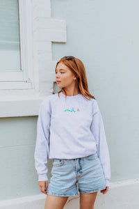 Embroidered trio of colourful moths sweater