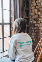 Load image into Gallery viewer, Embroidered have a really lovely day back sweater with reminder sleeve