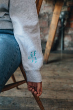 Load image into Gallery viewer, Embroidered have a really lovely day back sweater with reminder sleeve