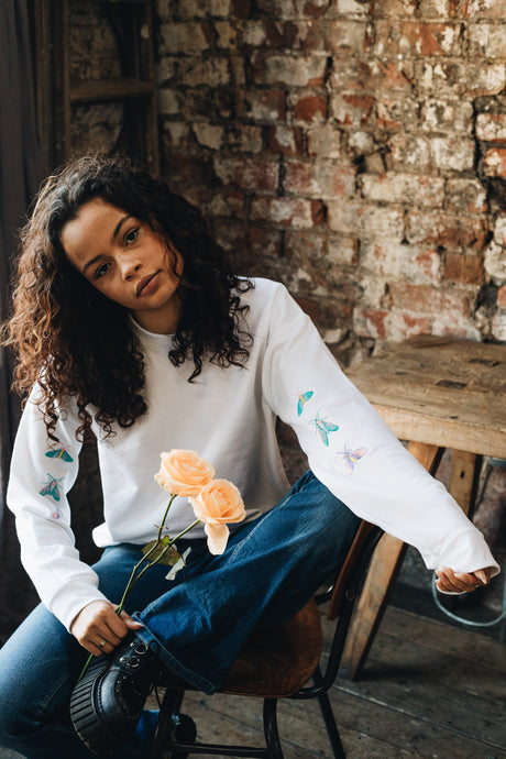 Embroidered trio of moths sleeve sweater