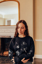 Load image into Gallery viewer, festive bugs embroidered sweater with bug star sleeve detail