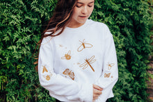 Load image into Gallery viewer, festive bugs embroidered sweater with bug star sleeve detail
