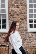 Load image into Gallery viewer, festive bugs embroidered sweater with bug star sleeve detail