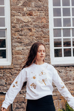 Load image into Gallery viewer, festive bugs embroidered sweater with bug star sleeve detail