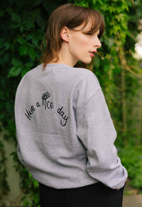 Have a nice day and daisy embroidered slogan sweater