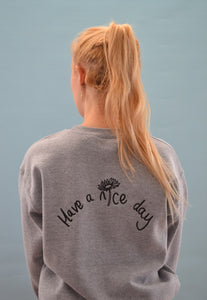Have a nice day and daisy embroidered slogan sweater